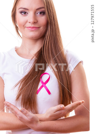 Woman wih pink cancer ribbon on chest Woman wih pink cancer ribbon on chest 127971555
