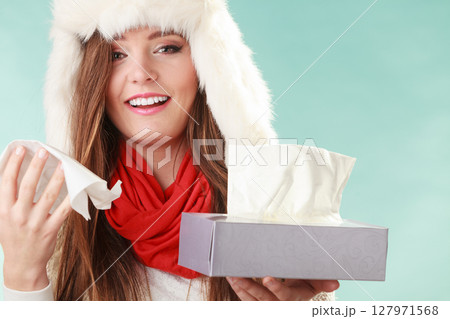 Sick woman sneezing in tissue. Winter cold. 127971568