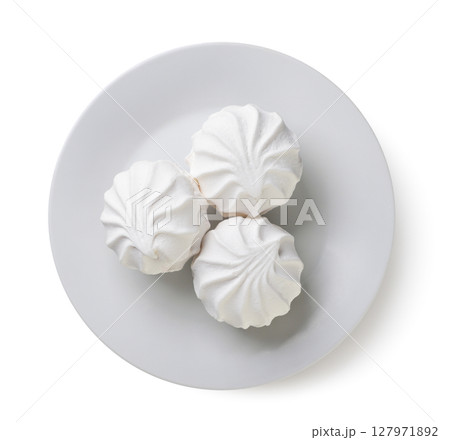 Round marshmallow on a plate on a white background. Top view 127971892