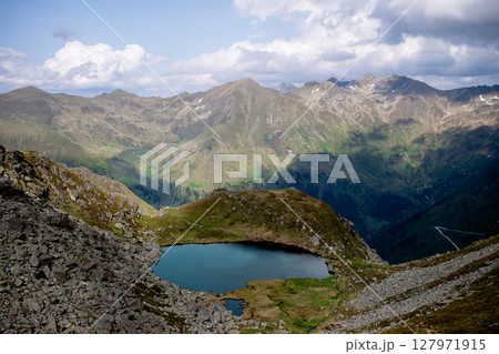 Scenic mountain lake nestled in remote valley in the Austrian Alps 127971915