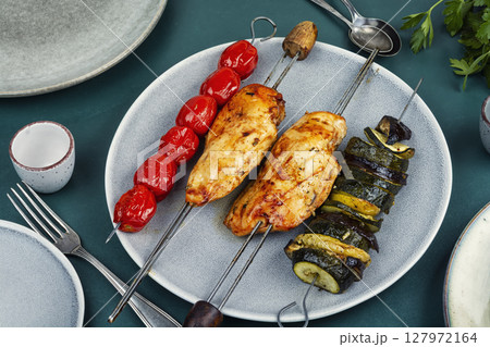 Chicken breast on skewers. Chicken breast on skewers. 127972164