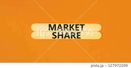 Market share symbol. Concept words Market share on beautiful wooden stick. Beautiful orange table orange background. Business and Market share concept. Copy space. 127972209