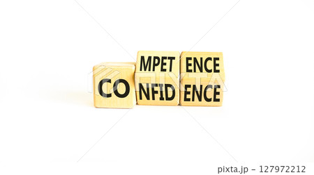Competence and confidence symbol. Concept word Competence Confidence on wooden cubes. Beautiful white table white background. Business competence confidence concept. Copy space. 127972212
