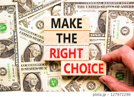 Make the right choice symbol. Concept words phrase Make the right choice on beautiful wooden blocks. Dollar bills. Beautiful dollar bills background. Business Make the right choice concept. Copy space 127972290