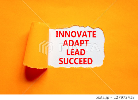 Innovate adapt lead succeed symbol. Concept words Innovate Adapt Lead Succeed on beautiful white paper. Beautiful orange background. Business innovate adapt lead succeed concept. Copy space. Innovate adapt lead succeed symbol. Concept words Innovate Adapt Lead Succeed on beautiful white paper. Beautiful orange background. Business innovate adapt lead succeed concept. Copy space. 127972418