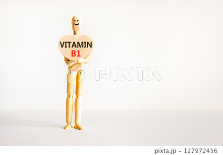 Vitamin B1 symbol. Concept words Vitamin B1 on beautiful wooden heart. Doctor's model. Beautiful white background. Copy space. Medical healthy lifestyle Vitamin B1 concept. 127972456