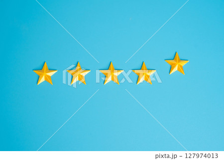 Adding a fifth star. Highest rating. Excellence, premium status, or service upgrades. Hotel rankings, product reviews, customer feedback, or quality certification. 127974013