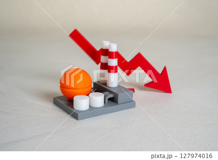 Industrial plant and red arrow down. Production decline, low revenue. Cost reduction. Credit rating decline. Crisis in industry. Economic downturn, job cuts, factory closures, declining orders. Industrial plant and red arrow down. Production decline, low revenue. Cost reduction. Credit rating decline. Crisis in industry. Economic downturn, job cuts, factory closures, declining orders. 127974016