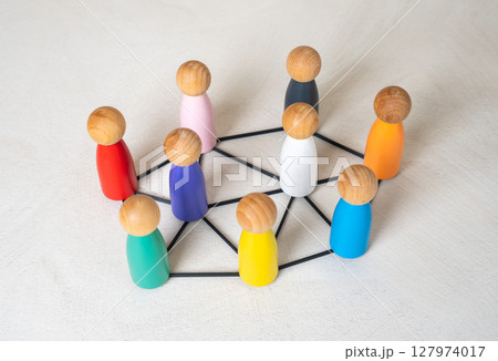 Multicolored figures of people are connected by lines. Multiculturalism, cooperation. Cultures and nations work together. Connection between countries. Diversity, international teamwork 127974017