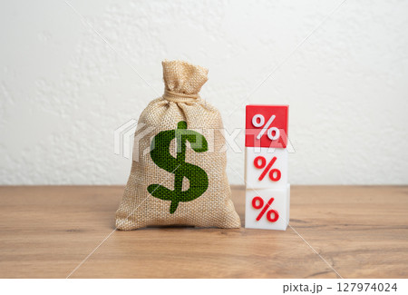Dollar money bag and interest rates. Income taxes. Interest rates on loans. Fines and fees. Burden of debt, inflation. Personal finance, banking, and macroeconomic shifts. Dollar money bag and interest rates. Income taxes. Interest rates on loans. Fines and fees. Burden of debt, inflation. Personal finance, banking, and macroeconomic shifts. 127974024