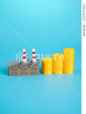 Industrial plant and growing stack of money coins. Increase in income and orders. Increase in wages of workers in factories. Positive impact of government subsidies and contracts. Industrial plant and growing stack of money coins. Increase in income and orders. Increase in wages of workers in factories. Positive impact of government subsidies and contracts. 127974161