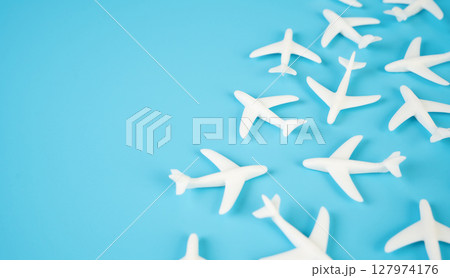 Airplane figures and space for text. Aviation industry. Flights and tourism. Air traffic growth, flight booking trends, airport infrastructure, or airline industry performance. Airplane figures and space for text. Aviation industry. Flights and tourism. Air traffic growth, flight booking trends, airport infrastructure, or airline industry performance. 127974176