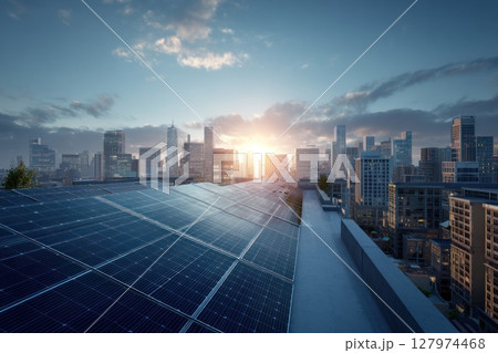 A rooftop in early morning light features multiple rows of solar panels, reflecting the sky. Towering modern buildings and futuristic architecture stretch into the distance under a soft golden glow. 127974468