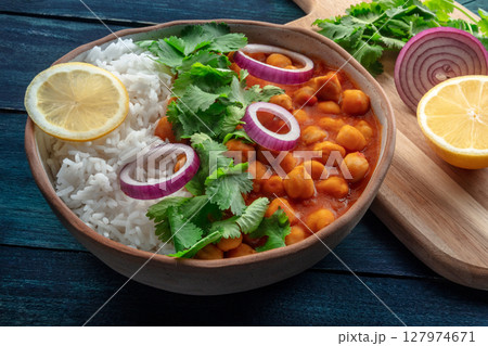 Chana masala, chickpea curry, traditional Indian dish, with ingredients 127974671