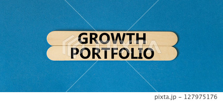 Growth portfolio symbol. Concept words Growth portfolio on beautiful wooden stick. Beautiful blue paper background. Business Growth portfolio concept. Copy space. 127975176