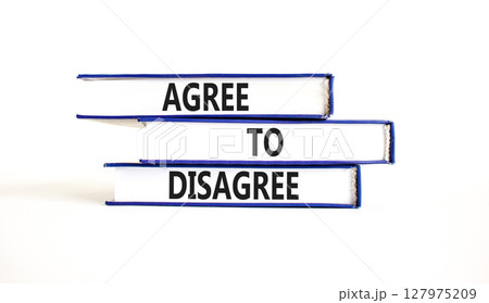 Agree to disagree symbol. Concept words Agree to disagree on beautiful books. Beautiful white paper background. Business and agree to disagree concept. Copy space. Agree to disagree symbol. Concept words Agree to disagree on beautiful books. Beautiful white paper background. Business and agree to disagree concept. Copy space. 127975209