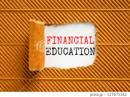 Financial education symbol. Concept words Financial education on beautiful white paper. Beautiful brown paper background. Business Financial education concept. Copy space. 127975382