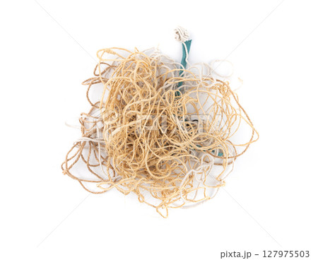 String piece isolated, jute rope fragment, part of packaging cord knots, eco-friendly natural rope String piece isolated, jute rope fragment, part of packaging cord knots, eco-friendly natural rope 127975503