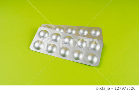 Pill Blister on Color Background, Silver Medicine Capsule Package, Drugs Packaging, Pill Pack 127975526