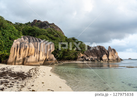 Granite rock formations along the shoreline of Anse Source d'Argent, La Digue Granite rock formations along the shoreline of Anse Source d'Argent, La Digue 127975838