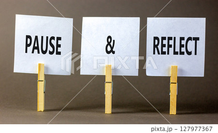Pause and reflect symbol. Concept words Pause and reflect on beautiful white paper on clothespin. Beautiful grey background. Business motivational lifestyle pause and reflect concept. Copy space. Pause and reflect symbol. Concept words Pause and reflect on beautiful white paper on clothespin. Beautiful grey background. Business motivational lifestyle pause and reflect concept. Copy space. 127977367