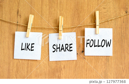 Like share follow symbol. Concept words Like Share Follow on beautiful white paper on clothespin. Beautiful wooden background. Business like share follow concept. Copy space. Like share follow symbol. Concept words Like Share Follow on beautiful white paper on clothespin. Beautiful wooden background. Business like share follow concept. Copy space. 127977368