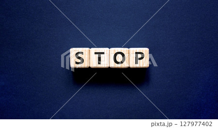 Stop symbol. Concept word Stop on beautiful wooden blocks. Beautiful black table black background. Business, lifestyle, support and stop concept. Copy space. 127977402