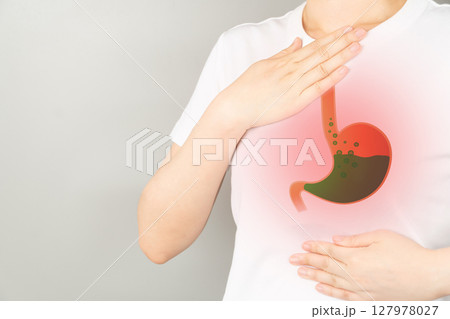 Gastroesophageal reflux disease (GERD) or acid reflux symptoms. Woman suffering from heartburn, stomachache, nausea and bloating. Gastrointestinal system disease and digestive problems. 127978027