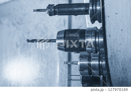 The hole tool in the tool magazine of machining center in the light blue scene. The hole tool in the tool magazine of machining center in the light blue scene. 127978189