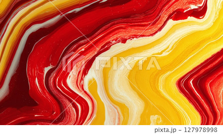 Abstract vibrant swirls of yellow and red paint form a dynamic, fluid pattern, evoking energy and movement in a mesmerizing visual display. 127978998
