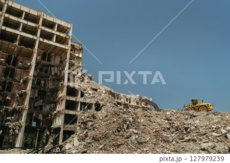 Ruins of a collapsed residential building in the demolition zone 127979239