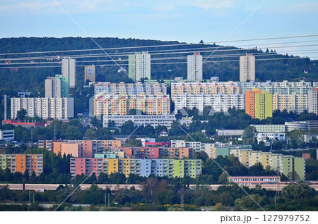 Original prefabricated houses on a housing estate from the communist era in Eastern and Central Europe after reconstruction.. Facade of a modern apartment building with windows and balconies. Czech Original prefabricated houses on a housing estate from the communist era in Eastern and Central Europe after reconstruction.. Facade of a modern apartment building with windows and balconies. Czech 127979752