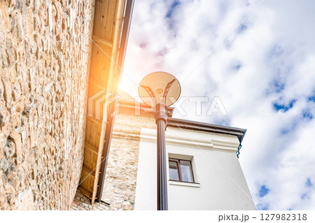thick walls and blue sky at Castle. Ancient medieval castle palace thick walls and blue sky at Castle. Ancient medieval castle palace 127982318