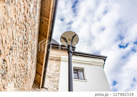 thick walls and blue sky at Castle. Ancient medieval castle palace thick walls and blue sky at Castle. Ancient medieval castle palace 127982319