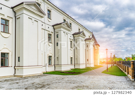 Scenic view of medieval castle in sun light. Beautiful sunny scenery in evening. Scenic view of medieval castle in sun light. Beautiful sunny scenery in evening. 127982340