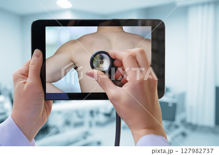 Doctor with tablet in virtual exam Doctor with tablet in virtual exam 127982737