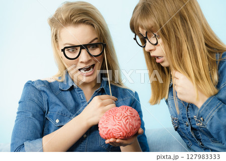 Two crazy women friends thinking Two crazy women friends thinking 127983333