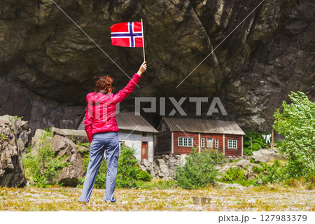 Tourist visiting Helleren houses in Jossingfjord, Norway 127983379