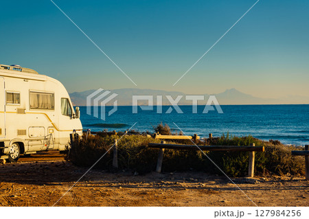 Camper car on beach, camping on nature Camper car on beach, camping on nature 127984256