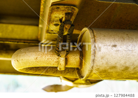 Damaged hangers of car muffler 127984488