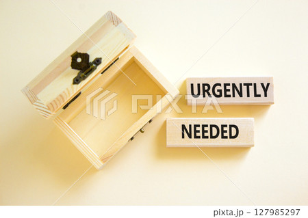 Urgently needed symbol. Concept words Urgently needed on wooden blocks on a beautiful white table white background. Empty wooden chest. Business and urgently needed concept. Copy space. Urgently needed symbol. Concept words Urgently needed on wooden blocks on a beautiful white table white background. Empty wooden chest. Business and urgently needed concept. Copy space. 127985297
