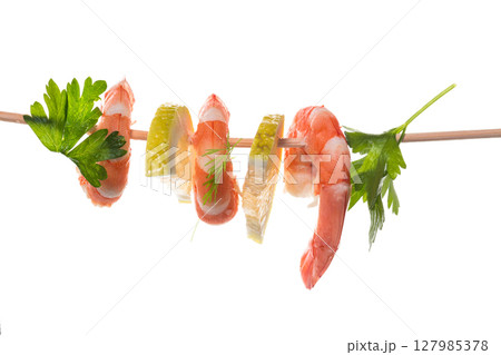 Still life of shrimps with lemon on white background Still life of shrimps with lemon on white background 127985378