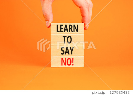 Learn to say no symbol. Concept words phrase Learn to say no on beautiful wooden blocks. Beautiful orange paper background. Businessman's hand Business psychological Learn to say no concept Copy space Learn to say no symbol. Concept words phrase Learn to say no on beautiful wooden blocks. Beautiful orange paper background. Businessman's hand Business psychological Learn to say no concept Copy space 127985452