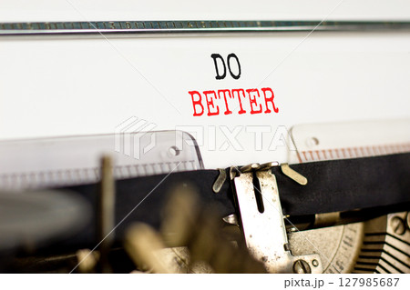 Do better symbol. Concept words Do better typed on beautiful old retro vintage typewriter. Beautiful white paper background. Business and do better concept. Copy space. 127985687