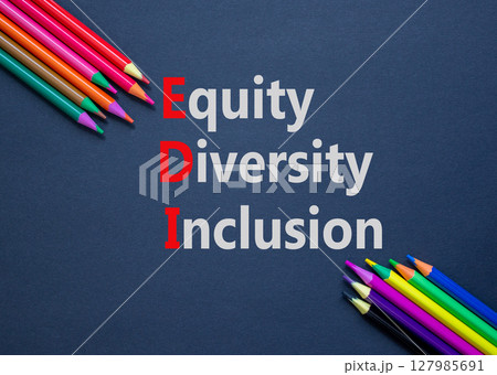 EDI equity diversity inclusion symbol. Concept words EDI equity diversity inclusion on paper. Beautiful black background. Colored pencils. Business EDI equity diversity inclusion concept. Copy space. EDI equity diversity inclusion symbol. Concept words EDI equity diversity inclusion on paper. Beautiful black background. Colored pencils. Business EDI equity diversity inclusion concept. Copy space. 127985691
