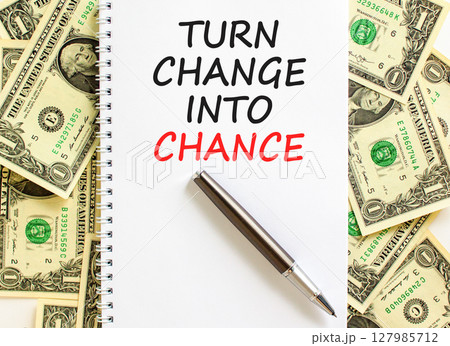Turn change into chance symbol. Concept words phrase Turn change into chance on beautiful note. Dollar bills. Beautiful dollar bills background. Business Turn change into chance concept. Copy space. Turn change into chance symbol. Concept words phrase Turn change into chance on beautiful note. Dollar bills. Beautiful dollar bills background. Business Turn change into chance concept. Copy space. 127985712