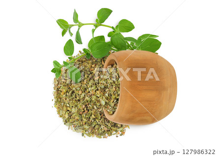 Oregano or marjoram leaves fresh and dry in wooden bowl isolated on white background. Top view. Flat lay Oregano or marjoram leaves fresh and dry in wooden bowl isolated on white background. Top view. Flat lay 127986322