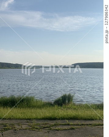 Quiet pond in the park during the day 127986342