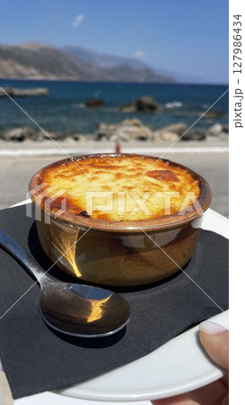 Freshly Baked Moussaka by the Sea with Scenic View Freshly Baked Moussaka by the Sea with Scenic View 127986434