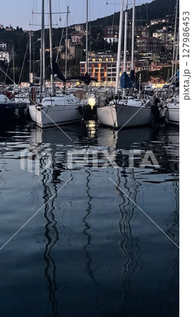 Evening Reflections on a Tranquil Harbor Evening Reflections on a Tranquil Harbor 127986453